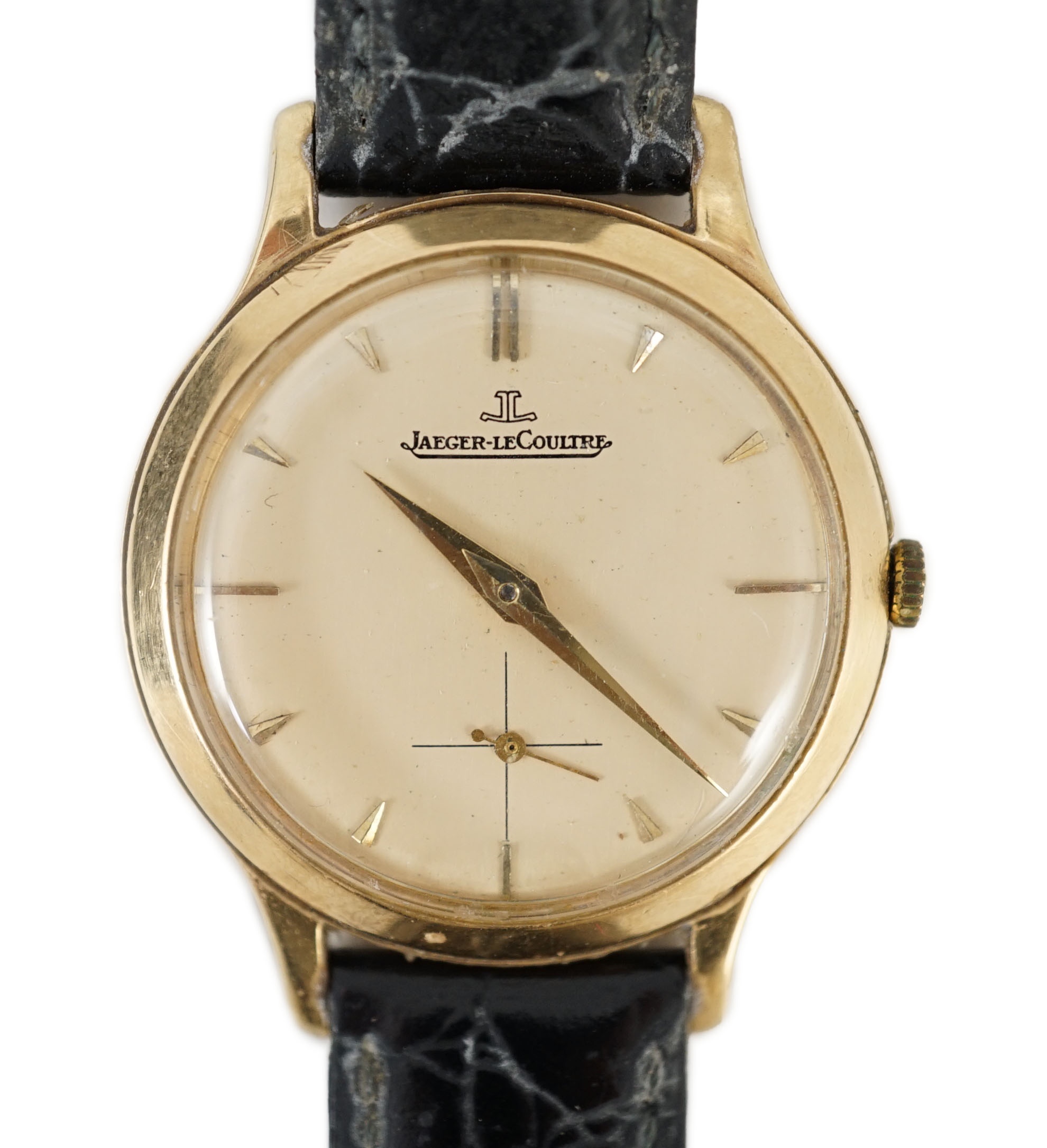 A gentleman's 9ct gold Jaeger LeCoultre manual wind dress wrist watch, on associated strap